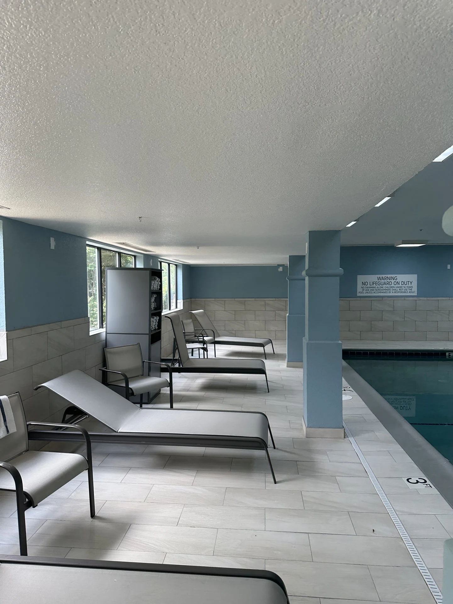 Interior pool room painting completed by Merit Painting & Drywall